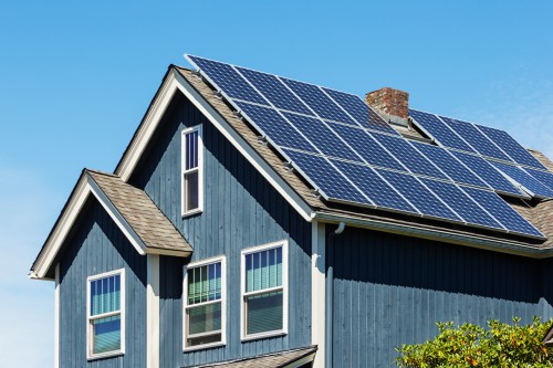 Traditional American Home with Modern Solar Panels on Roof